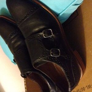 Black double monk brogue by Johnston & Murphy. Genuine leather.